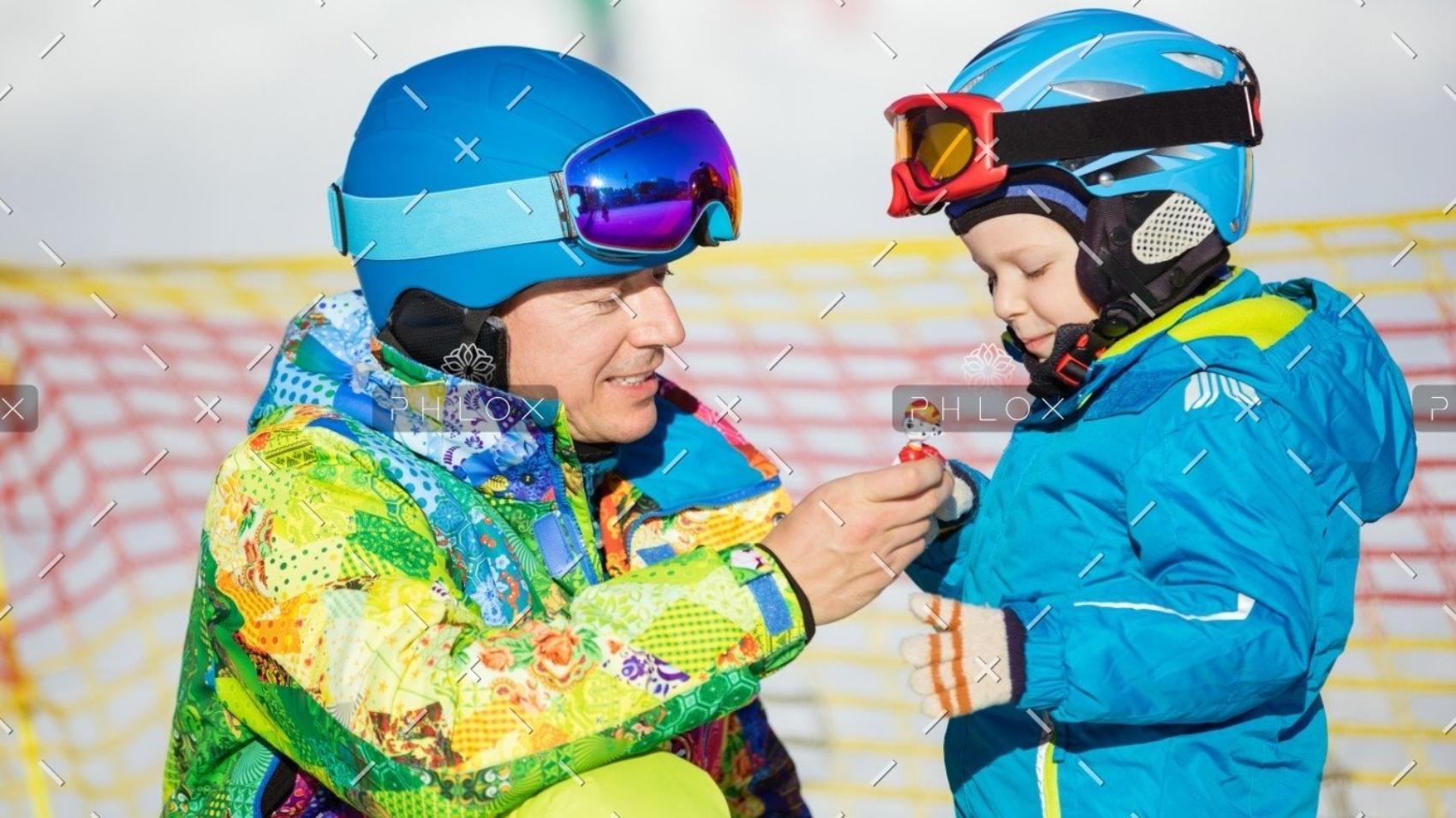 demo-attachment-148-father-and-little-son-in-skiing-outfits-playing-PMSY642